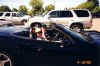 Sandy_and_Susie_sitting_in_the_Vette.jpg (103906 bytes)
